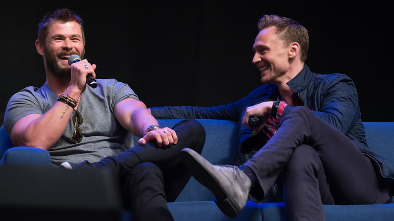 Hemsworth and Hiddleston laughing together