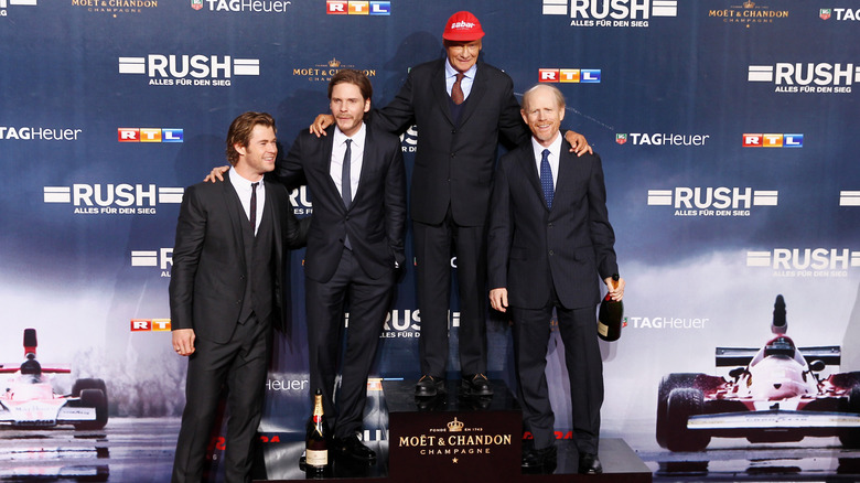 Hemsworth, Bruhl, Hunt, and Howard posing