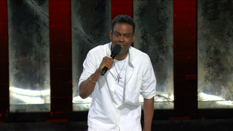 Chris Rock white shirt on stage wearing chain