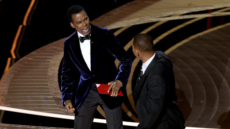 Chris Rock and Will Smith on stage at the 2022 Oscars