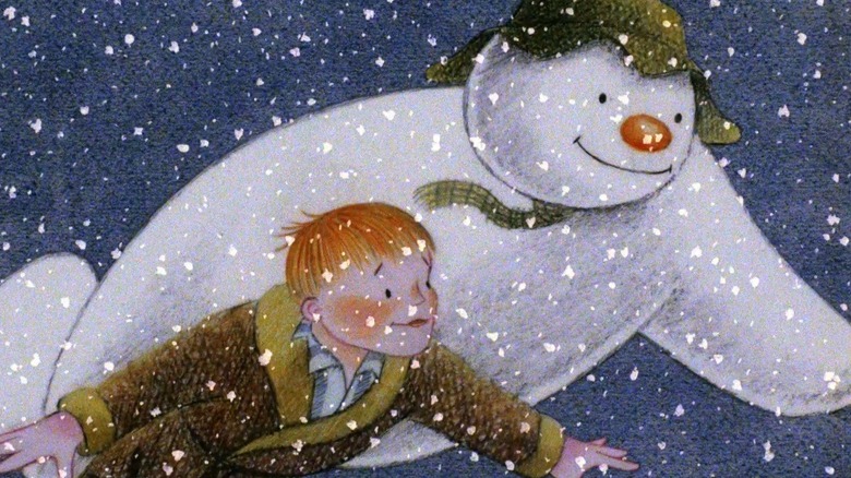 Snowman and boy flying