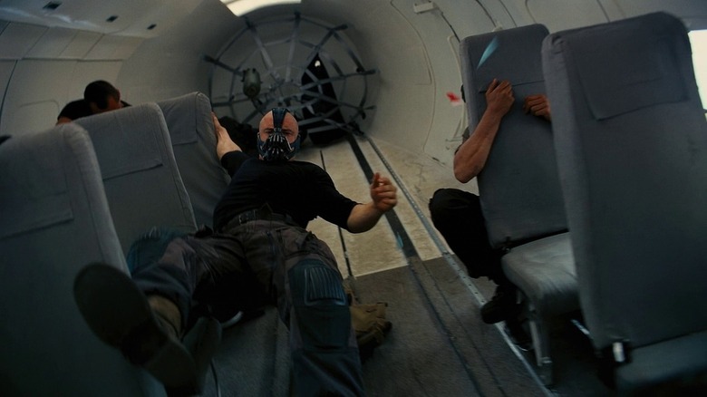 Bane climbing through airplane