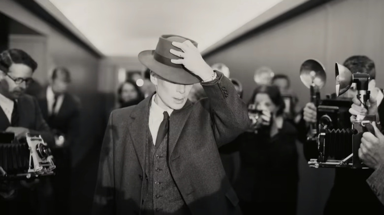 Oppenheimer walks past the press