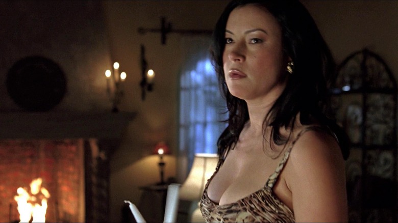 Jennifer Tilly holding candles