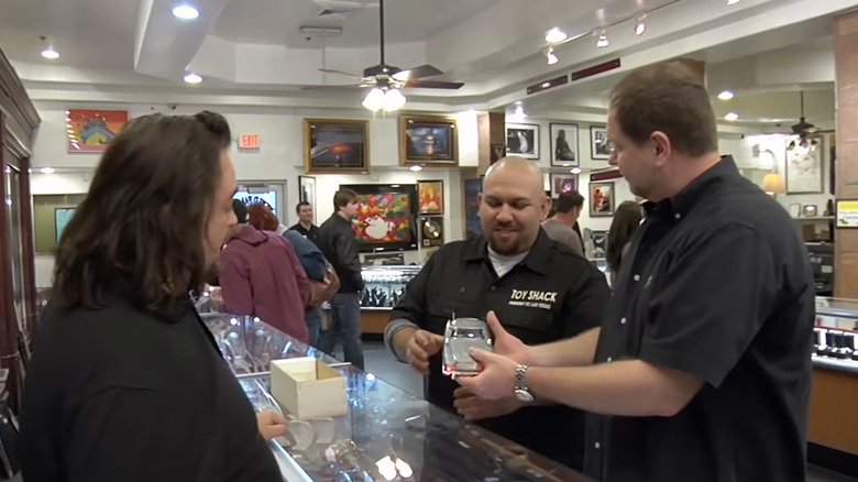 Chumlee and seller observing car