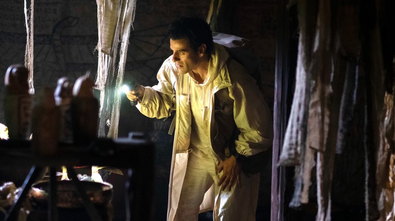 Oscar Isaac examining a tomb in "Moon Knight"