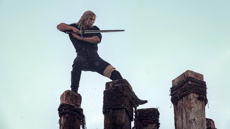 Henry Cavill practicing with a sword