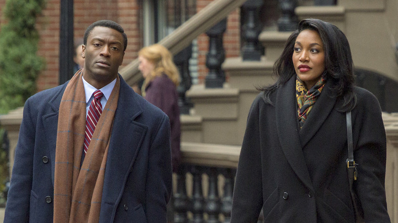 Aldis Hodge and Lauren Banks long coats