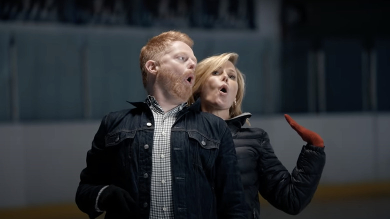 Claire and Mitchell singing while ice skating