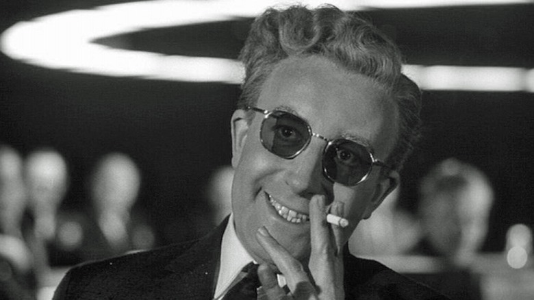 Dr. Strangelove smiles while smoking