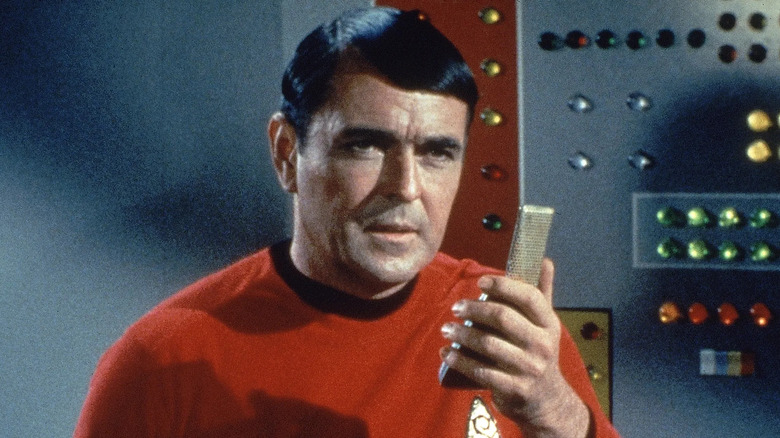 Scotty talking into a communicator