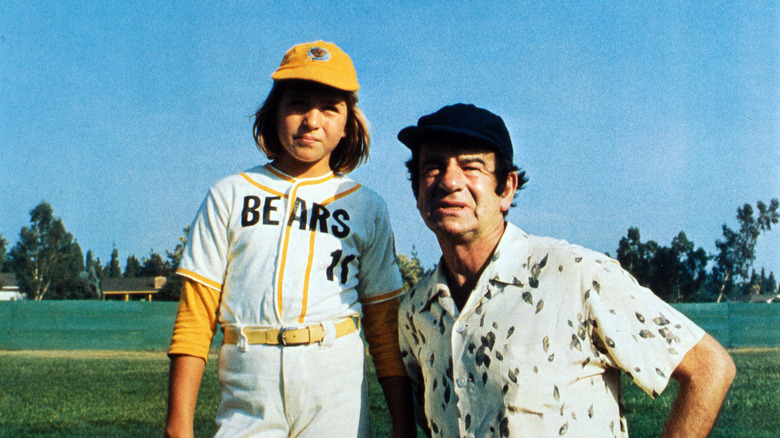 Tatum O'Neal and Walter Matthau on the field