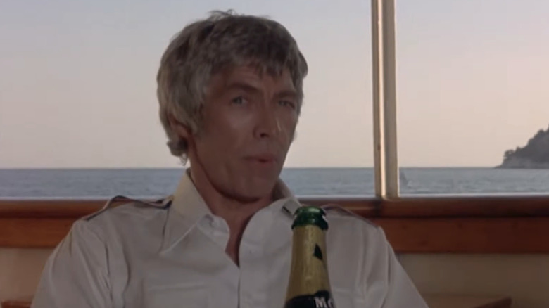 Clinton Green looks suspicious on a boat with champagne