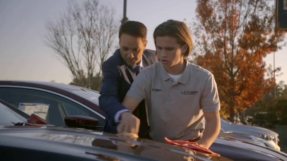 Daniel and Robby waxing cars