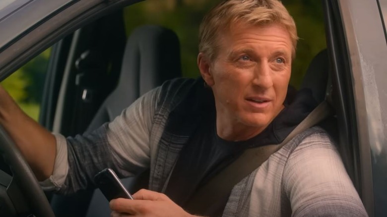 Johnny Lawrence in a car