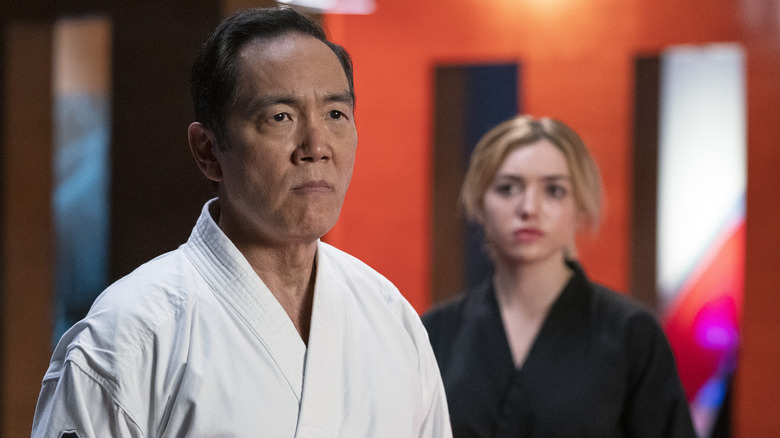 Yuji Okumoto as Chozen Toguchi, Peyton List as Tory Nichols in Cobra Kai