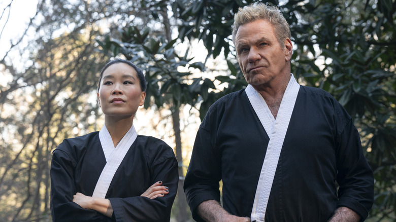 Martin Kove and Alicia Hannah-Kim serious