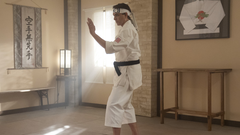 Daniel practicing karate in "Cobra Kai"