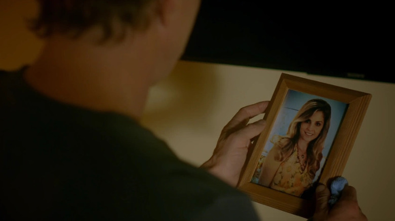 Johnny Lawrence looking at a picture of his mother in "Cobra Kai"