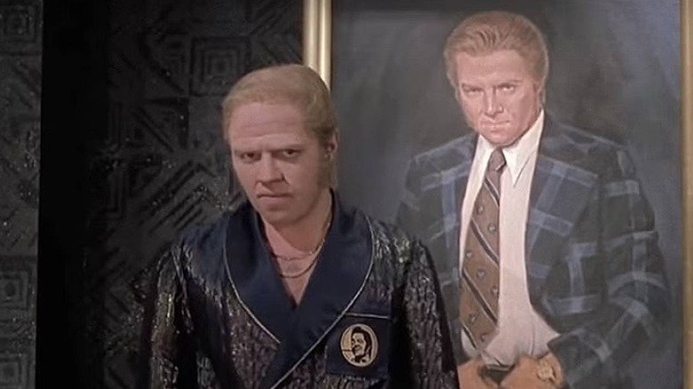 Biff Tannen stands in front of a portrait of himself in "Back to the Future II" (1989)