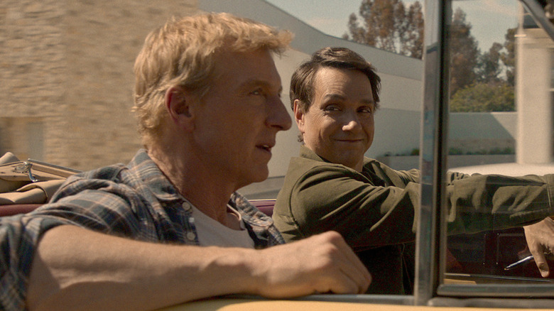 Daniel and Johnny ride in a yellow car on "Cobra Kai" (2025)