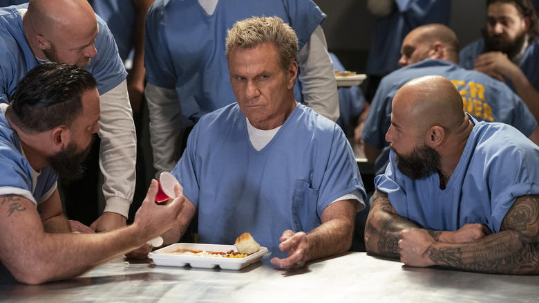 Inmates intimidate Kreese in the prison cafeteria