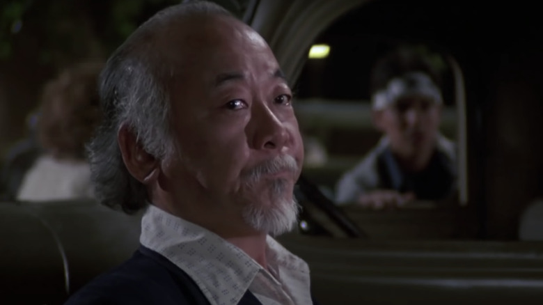 Mr. Miyagi standing by truck