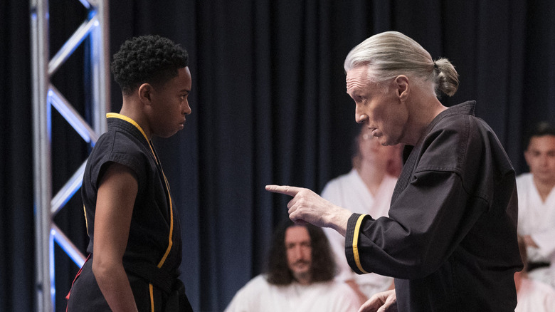 Dallas Dupree Young talking with Thomas Ian Griffith in Cobra Kai 