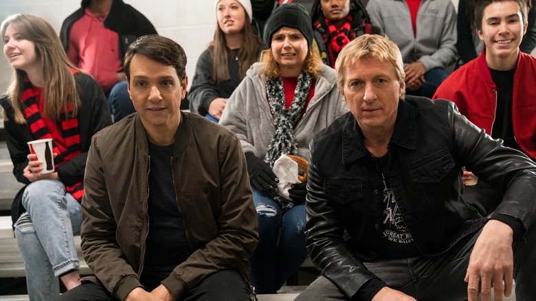 Ralph Macchio and William Zabka sitting together