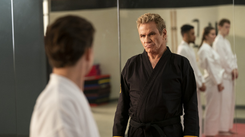 Tanner Buchanan and Martin Kove talking in Cobra Kai