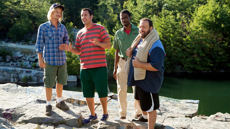 The gang stands on a rock next to a river in "Grown Ups" (2010)