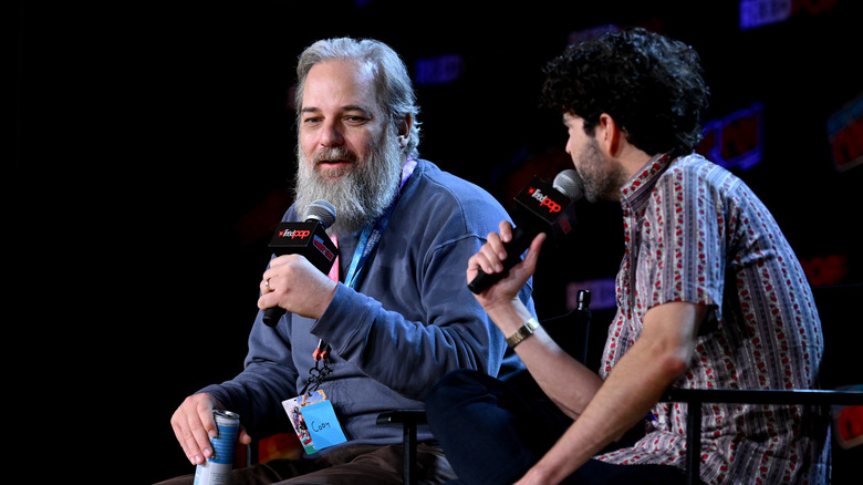 Dan Harmon and Nick Rutherford speak on stage