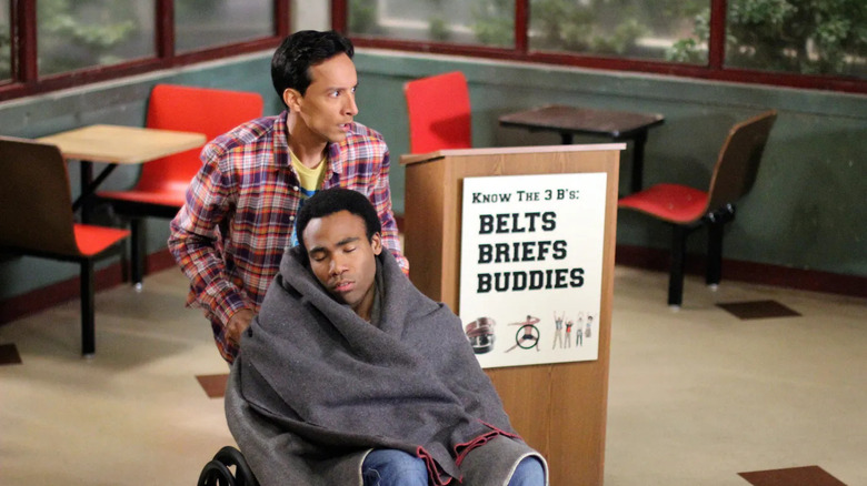 Abed pushes Troy in a wheelchair