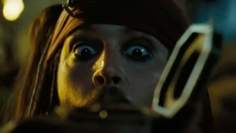 Jack Sparrow looks at his magical compass