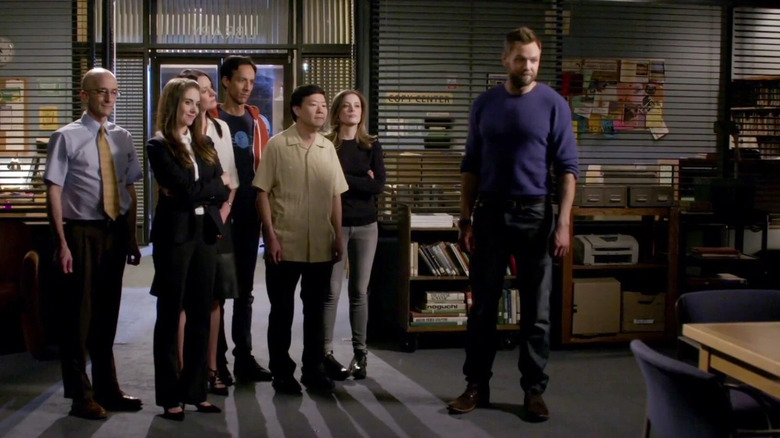 Dean Pelton, Annie Edison, Frankie Dart, Abed Nadir, Ben Chang, Britta Perry, and Jeff Winger standing in the study room in Community