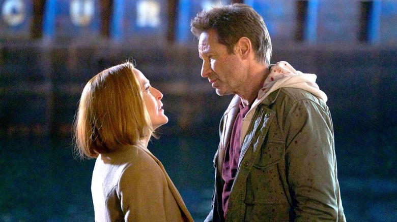 Dana Scully and Fox Mulder staring at each other in "The X-Files"