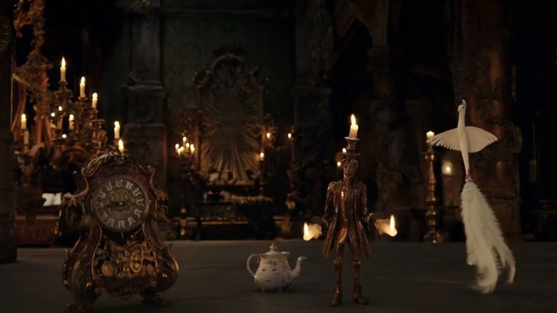 Cogsworth with Mrs. Potts, Lumière, and Plumette