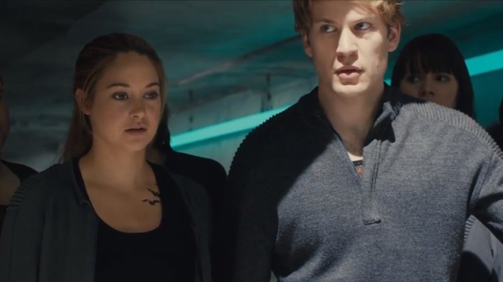 Tris and Four looking concerned