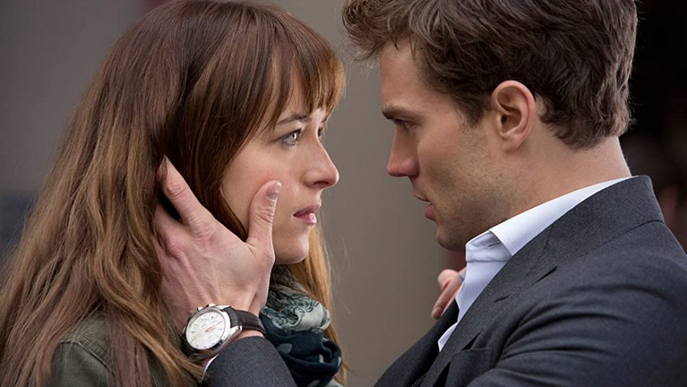 Christian holding Ana's face