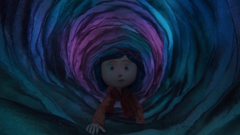 Coraline crawling through purple tunnel