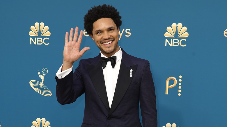 Trevor Noah smiling and waving