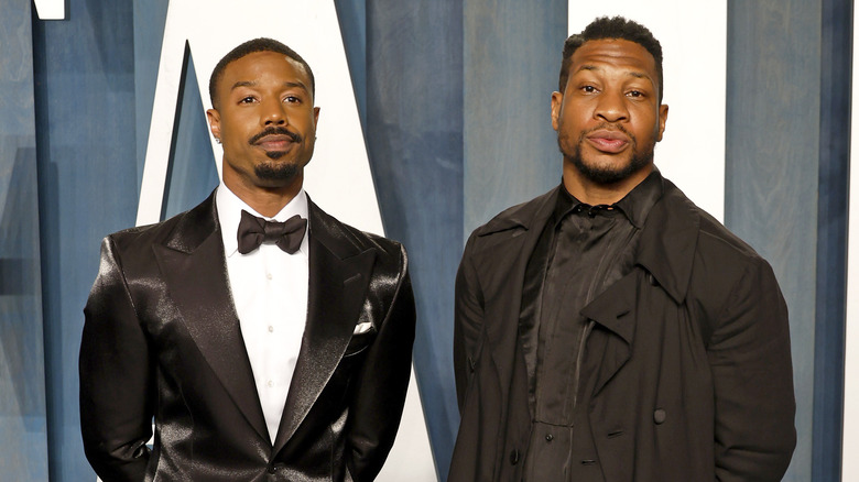 Michael B. Jordan and Jonathan Majors standing