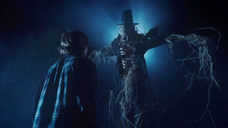 Kid looking up at Scarecrow