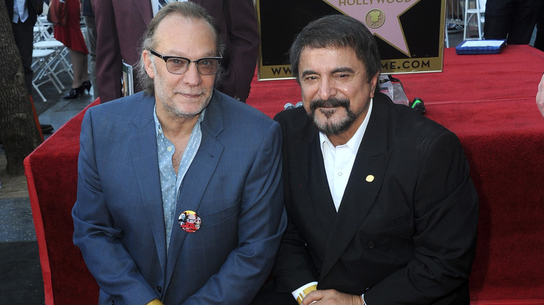 Greg Nicotero and Tom Savini kneeling