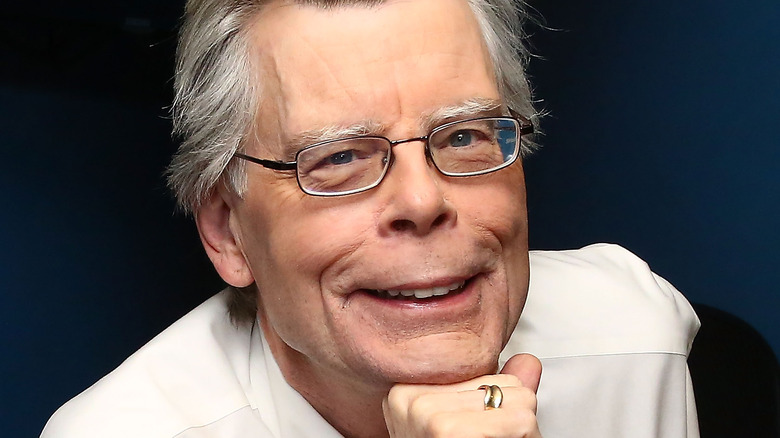 Stephen King with chin on first