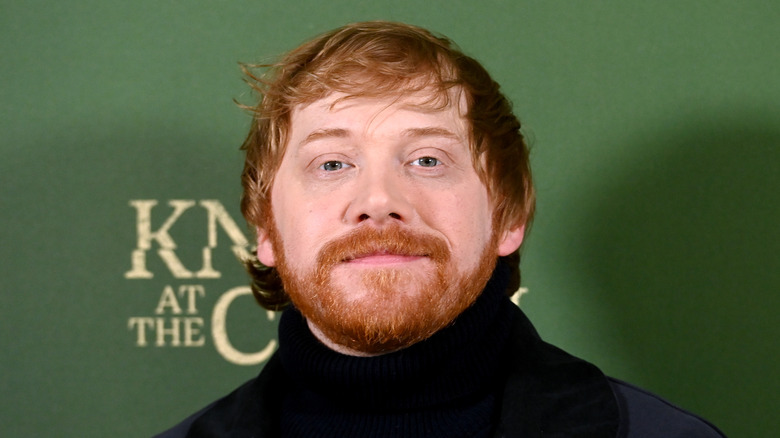 Rupert Grint smiling with beard