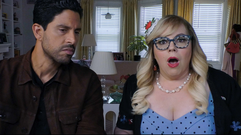 Adam Rodriguez as Luke Alvez looking serious and Kirsten Vangsness as Penelope Garcia looking shocked on Criminal Minds: Evolution