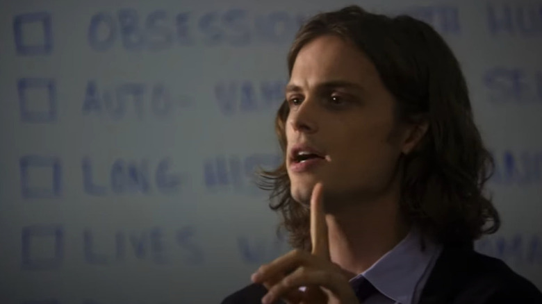 Spencer Reid raising finger lecturing