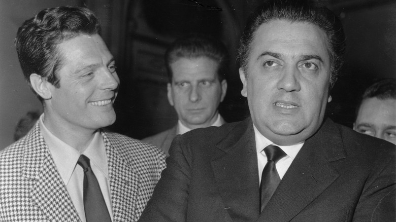 Fellini and Marcello Mastroianni in suits