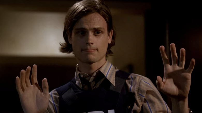 Spencer Reid with hands up